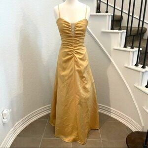 Masquerade gold plunge spaghetti strap gown with rhinestone detail. Size 5/6